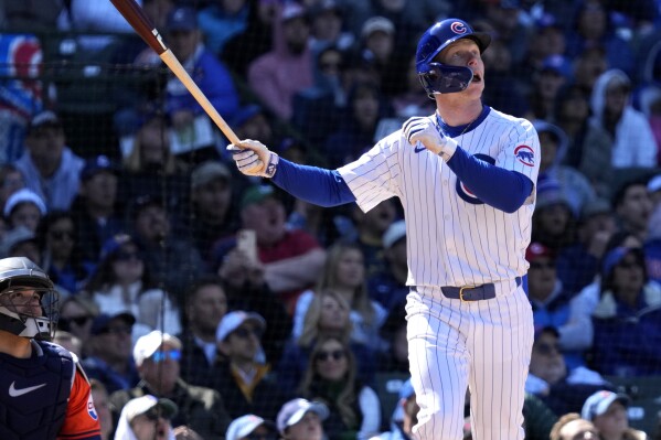 Chicago Cubs' Pete Crow-Armstrong watches his two-run home run during the sixth inning of a baseball game against the Houston Astros in Chicago, Thursday, April 25, 2024. (AP Photo/Nam Y. Huh)