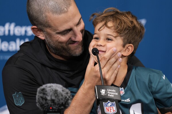 Philadelphia Eagles head coach Nick Sirianni speaks during a news conference with son Miles after an NFL football game against the Cleveland Browns on Sunday, Oct. 13, 2024, in Philadelphia. (AP Photo/Chris Szagola)
