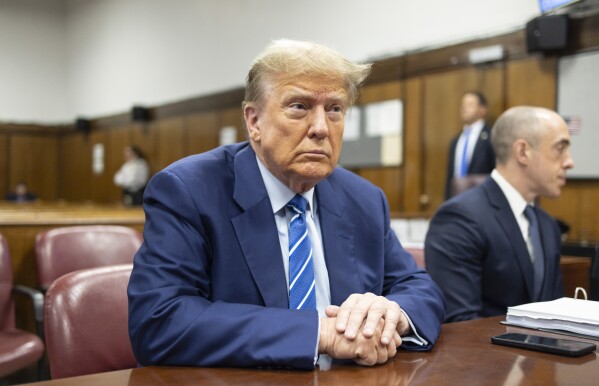 Former President Donald Trump awaits the start of proceedings on the second day of jury selection at Manhattan criminal court, Tuesday, April 16, 2024, in New York. Donald Trump returned to the courtroom Tuesday as a judge works to find a panel of jurors who will decide whether the former president is guilty of criminal charges alleging he falsified business records to cover up a sex scandal during the 2016 campaign. (Justin Lane/Pool Photo via AP)