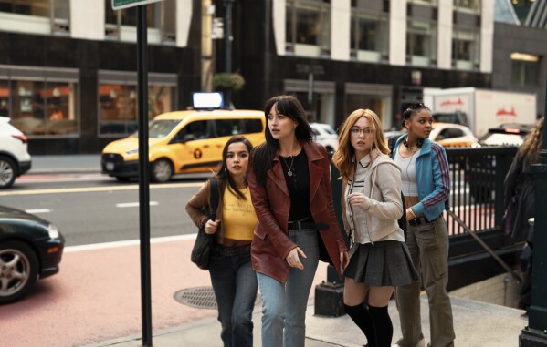This image released by Sony Pictures shows, from left, Isabela Merced, Dakota Johnson, Sydney Sweeney and Celeste O'Connor in a scene from "Madame Web." (Columbia Pictures/Sony via AP)