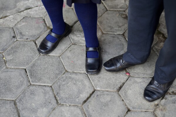 Kendo Taman and Nirmala Pariyar on the left are waiting at school for the bus to arrive at Lalitpur, Nepal on Thursday, March 27th, 2025.