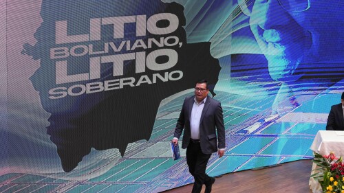 FILE - The sign reads in Spanish: "Bolivian lithium. Sovereign lithium." on stage where Carlos Ramos, president of the Bolivian state-owned company Yacimientos de Litio Bolivianos (YLB), attends an agreement signing ceremony with the companies Uranium One Group, a subsidiary of Russia's Rosatom and China's Citic Guoan Group, at the government palace in La Paz, Bolivia, June 29, 2023. The total of Bolivia’s confirmed lithium resources has increased 2 million tons to 23 million tons, the Andean country’s president said on July 20. (AP Photo/Juan Karita)
