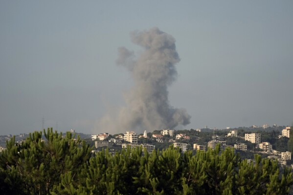 Smoke rises from an Israeli airstrike north of Beirut, in the village of Ras Osta, Byblos district, seen from Maaysrah, Lebanon, Wednesday, Sept. 25, 2024. (AP Photo/Bilal Hussein)