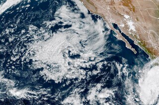 This satellite image provided by NOAA on Tuesday, Oct. 17, 2023, shows Tropical Storm Norma forming near the Mexican Western Pacific coast. (NOAA via AP)