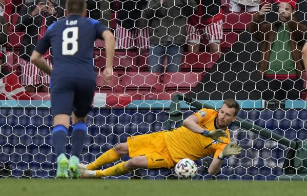 Finland's goalkeeper Lukas Hradecky makes a save during the Euro 2020 soccer championship group B match between Denmark and Finland at Parken stadium in Copenhagen, Saturday, June 12, 2021. (AP Photo/Martin Meissner, Pool)