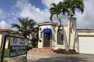A home is shown for sale, Thursday, March 18, 2021, in Surfside, Fla.  U.S. home prices jumped by the most in more than seven years in March, as an increasing number of would-be buyers compete for a dwindling supply of houses. The March S&P CoreLogic Case-Shiller 20-city home price index, released Tuesday, May 25, rose 13.3% from a year earlier, the biggest gain since December 2013.   (AP Photo/Wilfredo Lee)