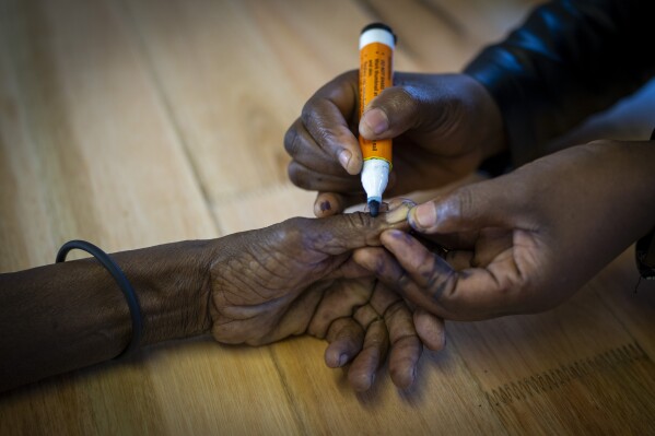 A woman's hand is tagged after casting her vote on Wednesday, May 29, 2024 during the general election in Nkandla, KwaZulu-Natal, South Africa.  South African voters cast their ballots in elections seen as the most important in their country in 30 years, an election that may put them in uncharted territory in the short history of their democracy, as the ANC's three-decade dominance has become the target of early elections.  A new generation of discontent in a country of 62 million people, half of whom are estimated to live in poverty.  (AP Photo/Emilio Morenatti)
