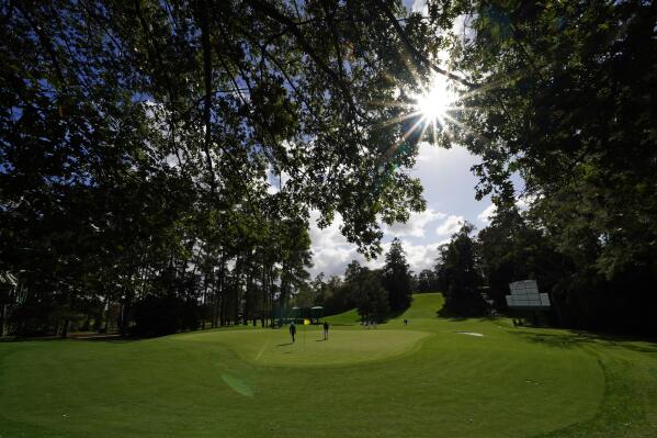 FILE - Max Homa and Patrick Cantlay walk to the sixth green during a practice round for the Masters golf tournament Monday, Nov. 9, 2020, in Augusta, Ga. (AP Photo/Matt Slocum, File)