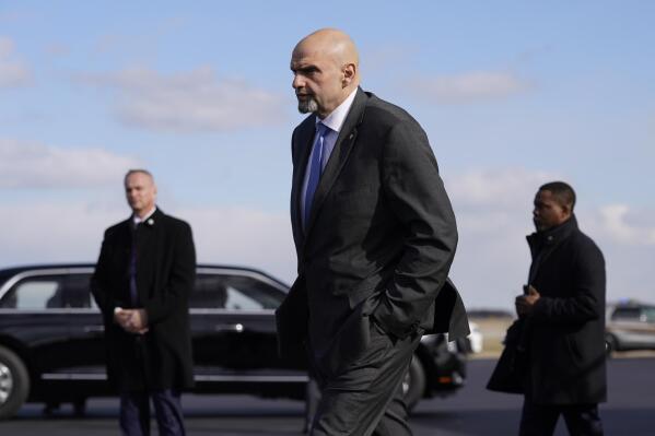 FILE - Sen. John Fetterman, D-Pa., walks to a motorcade vehicle after stepping off Air Force One behind President Joe Biden, Feb. 3, 2023, at Philadelphia International Airport in Philadelphia. A spokesman for Fetterman says the Democrat is “on a path to recovery” after checking himself into a hospital for clinical depression earlier this month, and that he is still expected to be away from the Senate for several weeks. (AP Photo/Patrick Semansky, File)