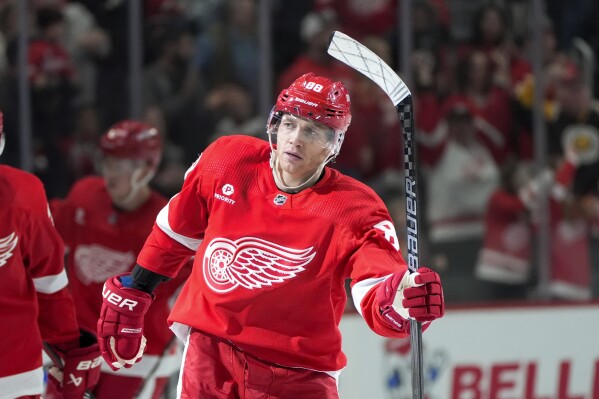 Detroit Red Wings right wing Patrick Kane (88) celebrates his goal against the Buffalo Sabres in the second period of an NHL hockey game Saturday, March 16, 2024, in Detroit. (AP Photo/Paul Sancya)
