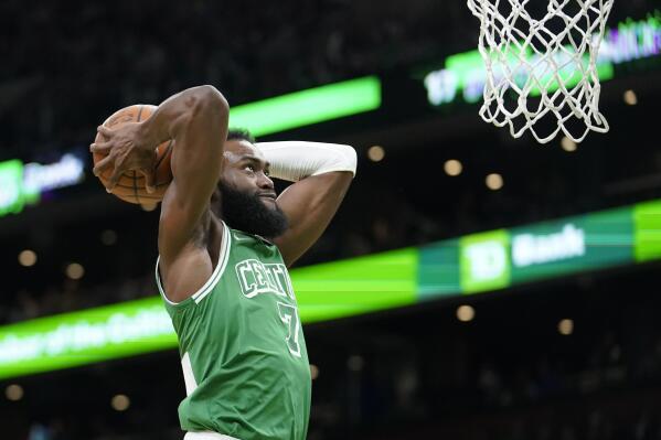 Boston Celtics guard Jaylen Brown (7) shoots at the basket in the first half of an NBA basketball game against the Washington Wizards, Sunday, April 3, 2022, in Boston. (AP Photo/Steven Senne)