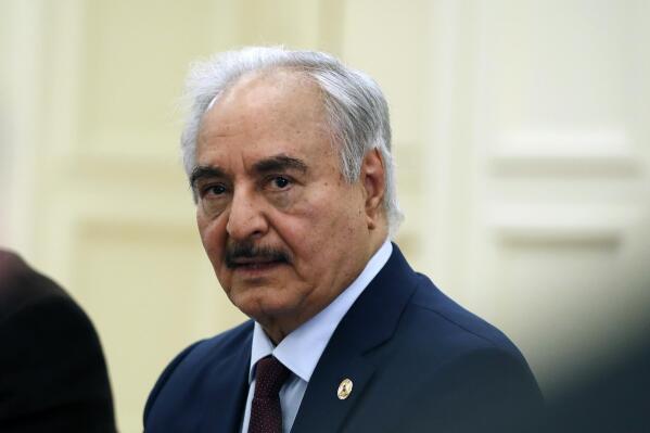 FILE - Libyan Gen. Khalifa Hifter joins a meeting with the Greek Foreign Minister Nikos Dendias in Athens, Greece, Jan. 17, 2020. Libya’s powerful commander, Khalifa Hifter, filed Tuesday, Nov. 16, 2021, as a candidate in the country’s presidential elections next month, as the long-waited vote faces growing uncertainty. Hifter submitted his candidacy papers in the eastern city of Benghazi and announced the move in a video. (AP Photo/Thanassis Stavrakis, File)