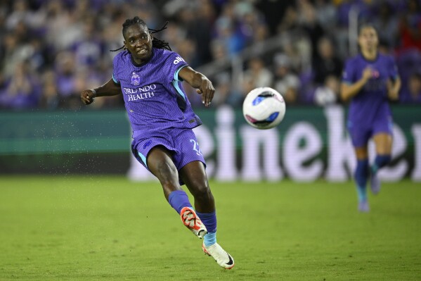 Orlando City forward Barbra Banda (22) scores a goal during an NWSL soccer match against the Chicago Stars, Friday, March 14, 2025, in Orlando, Fla. (AP Photo/Phelan M. Ebenhack)