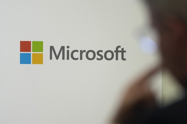 FILE - A logo of Microsoft is displayed during an event at the Chatham House think tank in London, Jan. 15, 2024. Microsoft said Wednesday that U.S. adversaries are beginning to use generative artificial intelligence to mount or organize offensive cyber operations. (APPhoto/Kin Cheung, File)