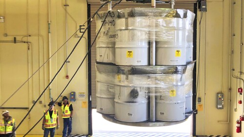 FILE - In this April 9, 2019, photo provided by Los Alamos National Laboratory, barrels of radioactive waste are loaded for transport to the Waste Isolation Pilot Plant, marking the first transuranic waste loading operations in five years at the Radioactive Assay Nondestructive Testing (RANT) facility in Los Alamos, N.M. A report from independent federal investigators Wednesday, July 19, 2023, said the price tag for cleaning up waste at the laboratory is rising and federal officials need to do more to track costs and progress of the $7 billion effort. (Nestor Trujillo/Los Alamos National Laboratory via AP, File)