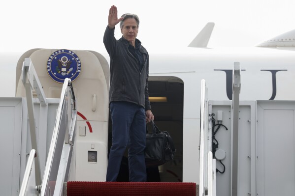 U.S. Secretary of State Antony Blinken gestures as he departs for Saudi Arabia in the latest Gaza diplomacy push, at Joint Base Andrews, Md., Saturday, April 28, 2024. (Evelyn Hockstein/Pool Photo via AP)