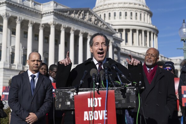 Rep. Jamie Raskin, D-Md., center, the top Democrat on the House Oversight Committee, is flanked by former U.S. Capitol Police Staff Sgt. Aquilino Gonell, left, and Rep. Glenn Ivy, D-Md., speaking during a news conference at the Capitol on threats to democracy three years after the January 6th riot, in Washington, Friday, Jan. 5, 2024. Democracy scholars are warning that political parties must accept the results of fair elections, reject violence and break ties to extremists. (AP Photo/J. Scott Applewhite)