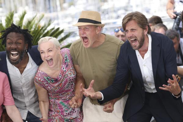 Jean-Christophe Folly, from left, Vicki Berlin, Woody Harrelson, and Ruben Östlund pose for photographers at the photo call for the film 'Triangle of Sadness' at the 75th international film festival, Cannes, southern France, Sunday, May 22, 2022. (Photo by Vianney Le Caer/Invision/AP)