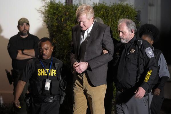 Alex Murdaugh is led outside the Colleton County Courthouse by sheriff's deputies after being convicted of two counts of murder Thursday, March 2, 2023, in Walterboro, S.C., in the June 7, 2021, shooting deaths of Murdaugh's wife and son. (AP Photo/Chris Carlson)