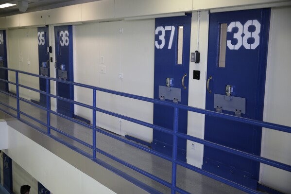 FILE- Numbered doors of enhanced supervision housing unit, also commonly known as solitary confinement, are shown at the Rikers Island jail complex on March 12, 2015, in New York. New York City lawmakers have passed a bill meant to ban solitary confinement in the city's jails. The bill overwhelmingly approved Wednesday, Dec. 20, 2023, still allows jails to isolate inmates for a maximum of four hours in "de-escalation" units. (AP Photo/Seth Wenig, File)