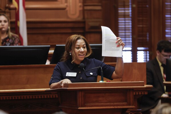 Rep. Mesha Mainor, R-Atlanta, speaks in favor of Senate Bill 233 at the Georgia State Capitol on Thursday, March 14, 2024. The bill would give $6,000 a year in state funds to the parents of each child who opts for private schooling. (Natrice Miller/Atlanta Journal-Constitution via AP)