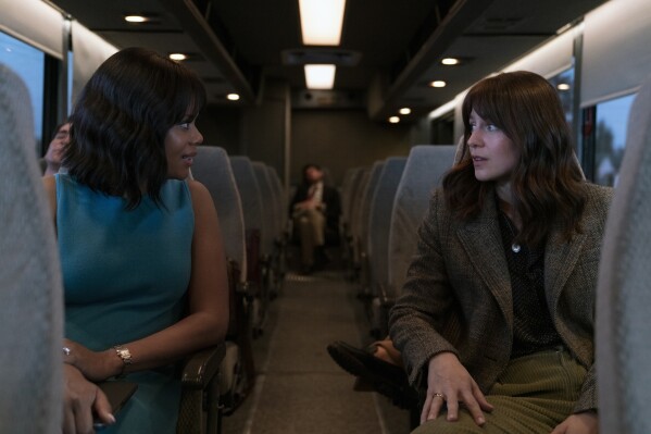 This image released by Max shows Christina Elmore, left, and Melissa Benoist in a scene from "The Girls on the Bus." (Nicole Rivelli/Max via AP)
