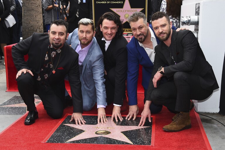 FILE - Chris Kirkpatrick, from left, Lance Bass, JC Chasez, Joey Fatone and Justin Timberlake attend a ceremony honoring NSYNC with a star on the Hollywood Walk of Fame on Monday, April 30, 2018, in Los Angeles. (Photo by Jordan Strauss/Invision/AP, File)