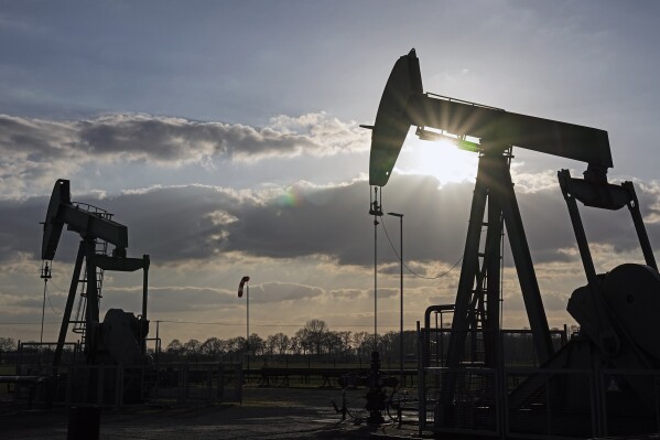 FILE - A pumpjack of Wintershall DEA extracts crude oil at an old oil field in Emlichheim, Germany, March 18, 2022. Oil prices are creeping higher and raising concerns about the impact on inflation’s cooling trajectory, consumers’ wallets and the Federal Reserve’s interest rate policy. (AP Photo/Martin Meissner, File)