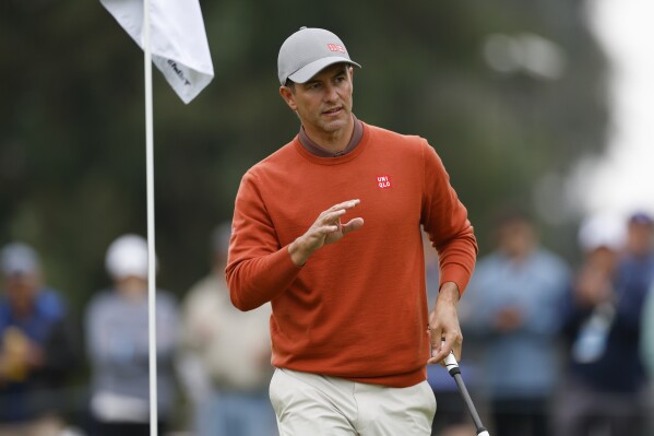 Adam Scott, of Australia, reacts after a birdie putt on the third hole during the third round of the Genesis Invitational golf tournament at Riviera Country Club, Saturday, Feb. 17, 2024, in the Pacific Palisades area of Los Angeles. (AP Photo/Ryan Kang)