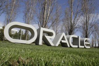In this March 22, 2011 photo, the company logo for Oracle Corp. headquarters is shown in Redwood City, Calif. Oracle is buying electronic medical records company Cerner. The companies said Monday, Dec. 20, 2021 that Cerner systems running on the Oracle Gen2 Cloud will be available 24 hours a day, every day, with the goal of having zero unplanned downtime. (AP Photo/Paul Sakuma, file)