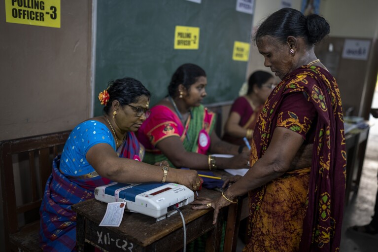 A woman prepares to vote during the first round of voting of India’s national election in Chennai, southern Tamil Nadu state, Friday, April 19, 2024. Nearly 970 million voters will elect 543 members for the lower house of Parliament for five years, during staggered elections that will run until June 1. (AP Photo/Altaf Qadri)