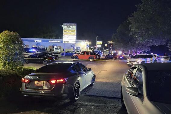 CORRECTS NAME TO EV LOUNGE NOT V LUXX HOOKAH LOUNGE This photo provided by the Fayetteville Police Department shows police working on the scene of a shooting near the EV Lounge in Fayetteville, N.C., Monday, April 3, 2023. (Fayetteville Police Department via AP)