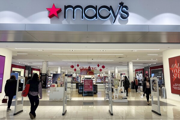 FILE - Shoppers enter a Macy's department store in Bay Shore, Long Island, New York, Dec. 12, 2023. Arkhouse Management and Brigade Capital Management announced Sunday, March 3, 2024, that they are upping their offer to acquire Macy's in a deal now valued at $6.6 billion. (AP Photo/Ted Shaffrey, File)