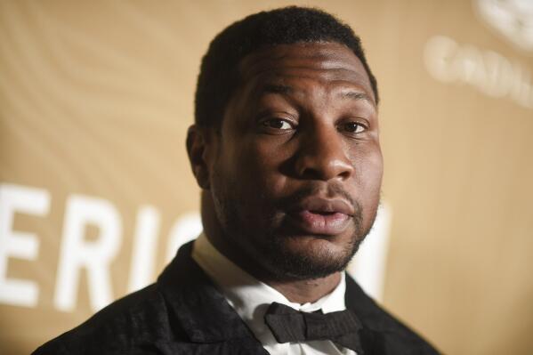 FILE - Jonathan Majors arrives at the American Black Film Festival Honors on March 5, 2023, at 1 Hotel in West Hollywood, Calif. Majors was confronted Tuesday, May 9, with a revised domestic violence charge stemming from a woman’s allegations that the Marvel star twisted her arm, struck her head and shoved her into a vehicle in New York City in March. (Photo by Richard Shotwell/Invision/AP, File)
