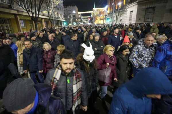 People march during a rally in downtown Belgrade, Serbia, Tuesday, Jan. 16, 2024. People rallied accusing the populist authorities of President Aleksandar Vucic of orchestrating a fraud during the Dec. 17 parliamentary and local election. The ruling Serbian Progressive Party was declared the election winner but the main opposition alliance, Serbia Against Violence, has claimed the election was stolen, particularly in the vote for the Belgrade city authorities. (AP Photo/Darko Vojinovic)