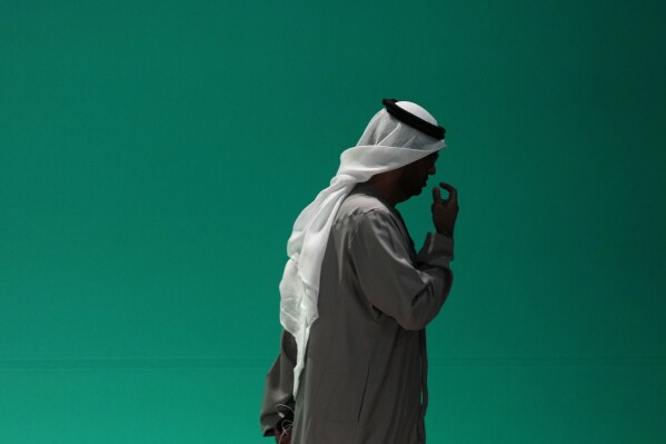 COP28 President Sultan al-Jaber leaves a plenary session at the COP28 U.N. Climate Summit, Wednesday, Dec. 13, 2023, in Dubai, United Arab Emirates. (AP Photo/Kamran Jebreili)