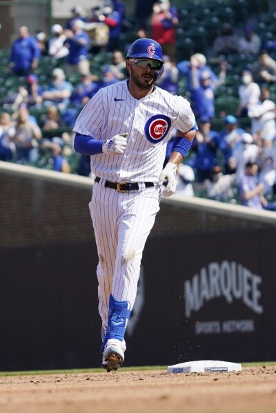 Kris Bryant of the Chicago Cubs rounds the bases to score on a