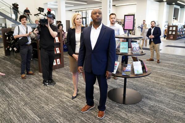 Sen. Tim Scott, R-S.C., tours the Marion Public Library, Wednesday, April 12, 2023, in Marion, Iowa. Scott on Wednesday launched an exploratory committee for a 2024 GOP presidential bid, a step that comes just shy of making his campaign official. (AP Photo/Charlie Neibergall)
