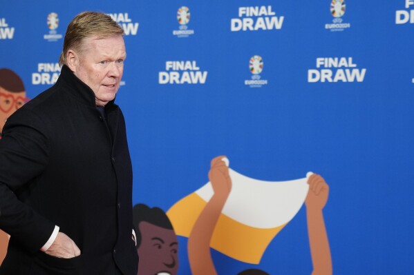 FILE - Netherlands head coach Ronald Koeman arrives for the draw for the UEFA Euro 2024 soccer tournament finals in Hamburg, Germany, Saturday, Dec. 2, 2023. Few aficionados in European soccer obsess about numbers the way the Dutch do. (AP Photo/Martin Meissner, File)