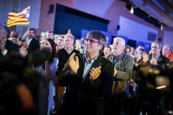 Former regional president Carles Puigdemont applauds during a campaign rally in Argelers, France, Wednesday, May 8, 2024. Carles Puigdemont, Catalonia's fugitive former leader, stares confidently out the backseat window of a car, the sun illuminating his gaze in a campaign poster for Sunday's critical elections in the northeastern Spanish region. Some nearly 6 million Catalans are called to cast ballots in regional elections on Sunday that will surely have reverberations in Spain's national politics. (Ǻ Photo/Joan Mateu)