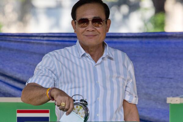 FILE - Thailand's Prime Minister Prayuth Chan-ocha casts his vote at a polling station in Bangkok, Thailand, Sunday, March 24, 2019, during the nation's first general election since the military seized power in a 2014 coup. Thailand's Constitutional Court suspended Prayuth from his duties on Wednesday, Aug. 25, 2022, while it decides whether he violated the country's term limits, potentially opening a new chapter of turmoil in the nation's troubled politics. (AP Photo/Gemunu Amarasinghe, File)
