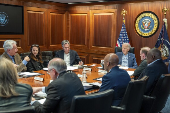 In this image released by the White House, President Joe Biden, third from right, meets with members of the National Security team regarding the unfolding missile attacks on Israel from Iran, Saturday, April 13, 2024, in the Situation Room of the White House in Washington. (Adam Schultz/The White House via AP)