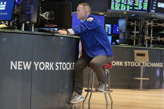 FILE - Traders work on the floor at the New York Stock Exchange in New York, Friday, June 2, 2023. (AP Photo/Seth Wenig, File)