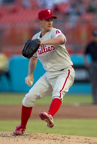 Controversial call helps Phils beat Marlins 5-4