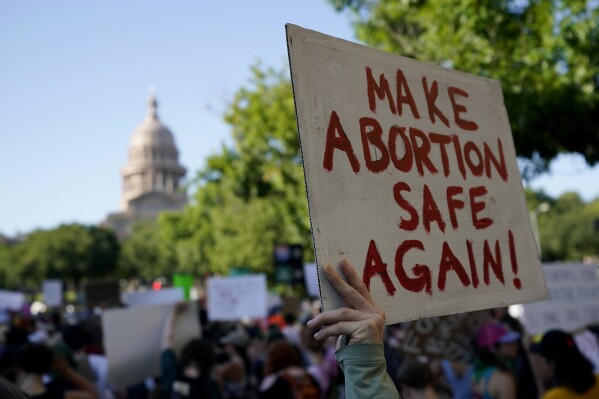 FILE - Demonstrators march and gather near the state capitol following the Supreme Court's decision to overturn Roe v. Wade, Friday, June 24, 2022, in Austin, Texas. A pregnant Texas woman whose fetus has a fatal diagnosis asked a court Tuesday, Dec. 5, 2023, to let her terminate the pregnancy, bringing what her attorneys say is the first lawsuit of its kind in the U.S. since Roe v. Wade was overturned last year. (APPhoto/Eric Gay, File)