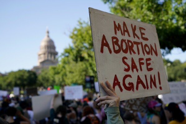 FILE - Demonstrators march and gather near the state capitol following the Supreme Court's decision to overturn Roe v. Wade, Friday, June 24, 2022, in Austin, Texas. A pregnant Texas woman whose fetus has a fatal diagnosis asked a court Tuesday, Dec. 5, 2023, to let her terminate the pregnancy, bringing what her attorneys say is the first lawsuit of its kind in the U.S. since Roe v. Wade was overturned last year. (AP Photo/Eric Gay, File)