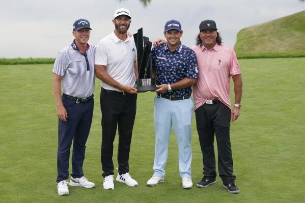 The "4 Aces" team poses for a picture after winning the team competition of the Bedminster Invitational LIV Golf tournament in Bedminster, N.J., Sunday, July 31, 2022. From left to right, Talor Gooch, Dustin Johnson. Patrick Reed, and Pat Perez. (AP Photo/Seth Wenig)