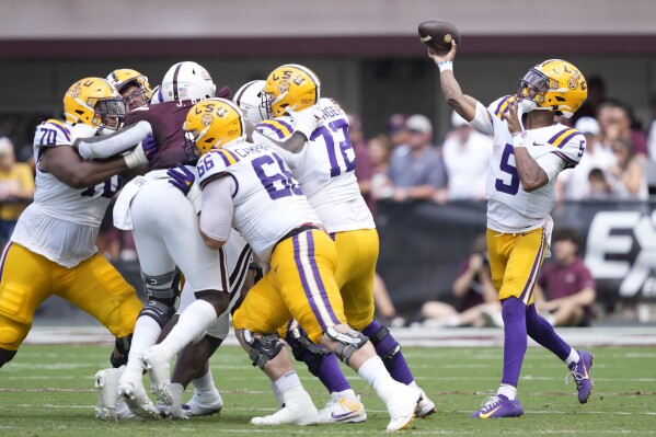 LSU quarterback Jayden Daniels (5) throws a pass against Mississippi State during the first half of an NCAA college football game, Saturday, Sept. 16, 2023, in Starkville, Miss. (AP Photo/Rogelio V. Solis)
