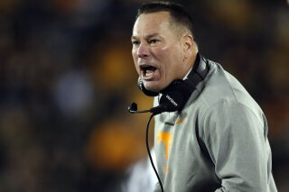 
              Tennessee head coach Butch Jones yells from the sideline during the first half of an NCAA college football game against Missouri, Saturday, Nov. 11, 2017, in Columbia, Mo. (AP Photo/Jeff Roberson)
            