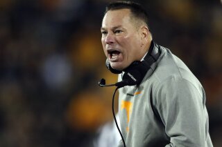 Tennessee head coach Butch Jones yells from the sideline during the first half of an NCAA college football game against Missouri, Saturday, Nov. 11, 2017, in Columbia, Mo. (AP Photo/Jeff Roberson)